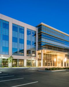 Modern commercial office building representing institutional real estate asset supported by C-PACE financing and construction advisory services