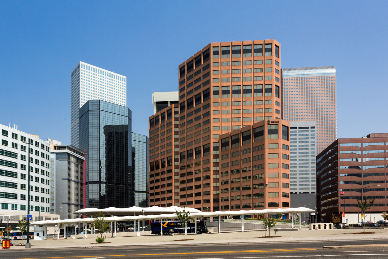 Modern commercial buildings in downtown Denver, Colorado, representing large-scale properties eligible for the state’s $35 million decarbonization grant program.