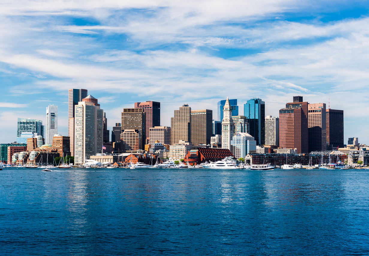 Boston skyline featuring large commercial office buildings along the waterfront in Massachusetts.